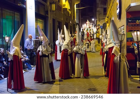 MURCIA, SPAIN - APRIL 15, 2014: Evening procession during Holy Week in Murcia. Semana Santa or Holy Week is Christian religious processions on  streets of Spanish cities