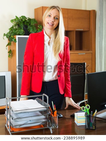 Woman in business outfit in office interior