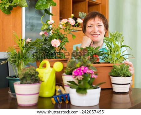 Grandmother gardener with plants at home