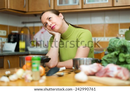 Exhausted woman needs to make dinner after working day