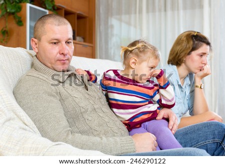 Family quarrel. Angry adult man against and unhappy young woman