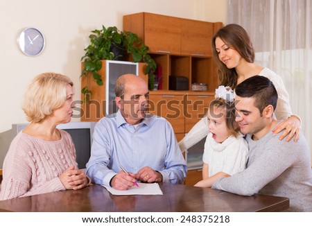 multigenerational family making shopping list together indoor