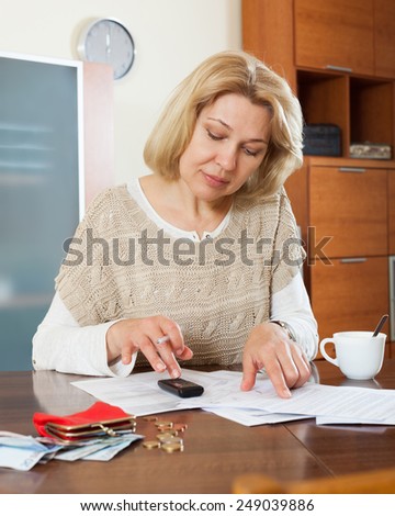 Wistful  woman thinking about the financial issue at  home