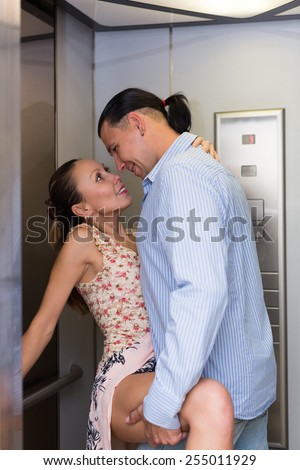 Hot woman with colleague making love at office lift