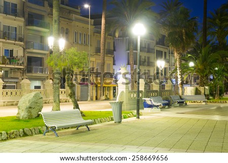 Pavement embankment in  night. Place for walking residents and vacationers. Sitges, Spain