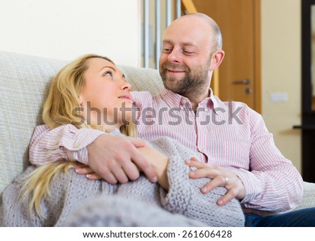 Happy loving family in living room at home