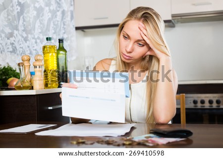 Sad   woman thinking about the financial problems  at home