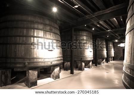 Old image  of  winery  with  wooden barrels