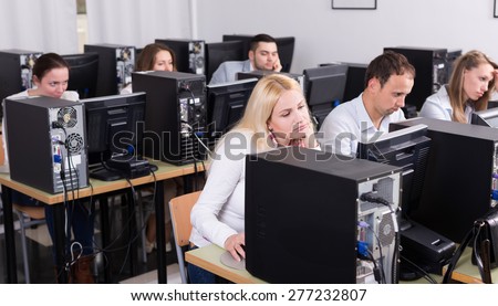 european staff sitting at desks and looking at PC screens