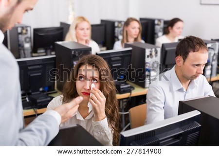 Strict boss and crying clerk at open space working area