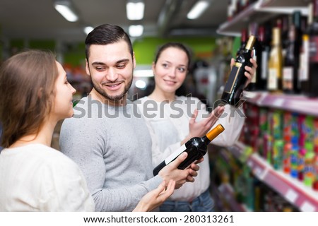 Positive people buying beverages for dinner at food grocery