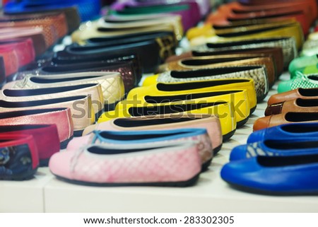 shoes diversity at shelves of apparel store
