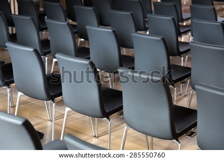 Rows of new  chairs in the presentations hall