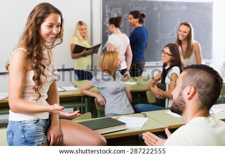 Happy students communication sitting in the classroom