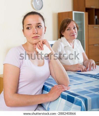 serious women with  documents at table in  office interior