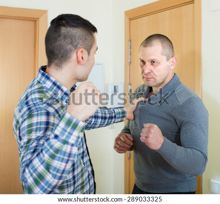 Family fight between two quarreling brothers at home