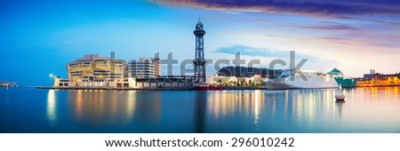 Panoramic view of Port Vell with liner in evening. Barcelona