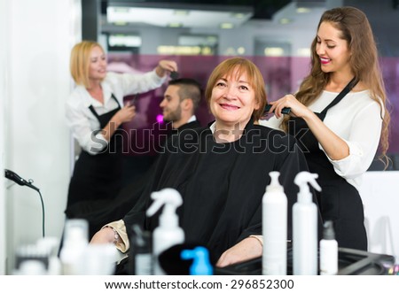 Portrait of positive smiling senior woman at the hairstylistÃ¢??s studio
