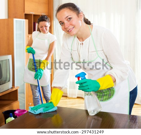 Beautiful women workers cleaning company ready to start work
