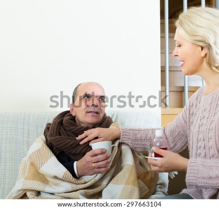Female social worker taking care of senior patient