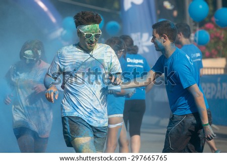 BARCELONA, SPAIN - JUNE 7, 2015: Dirty people running at The Color Run