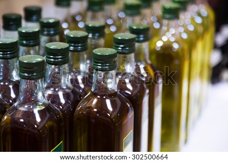 Bottles of olive oil on counter in shop
