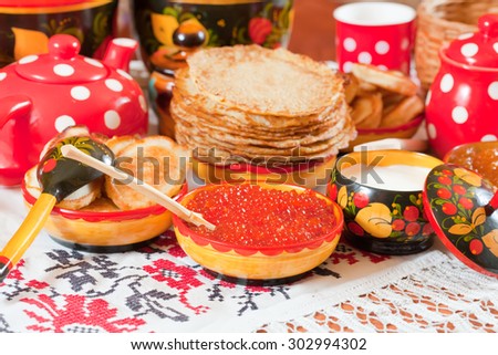 Russian Shrovetide meal - pancake with caviar and tea