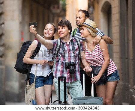 Cheerful travelers doing selfie in the sightseeing tour. Selective focus