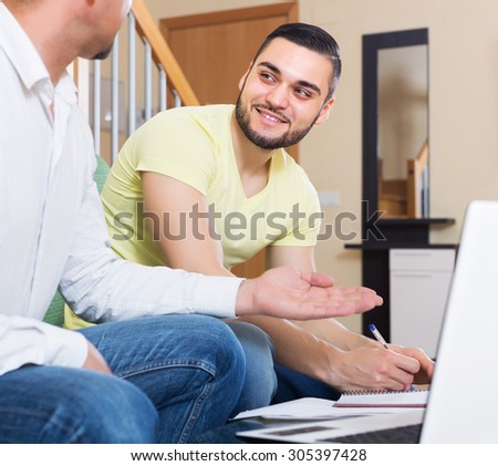 Professor giving private lesson to happy student at home
