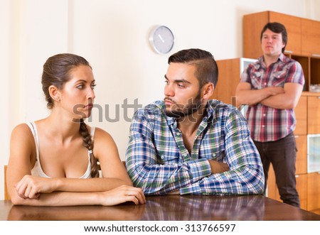 Young family having having argue about troubles at home