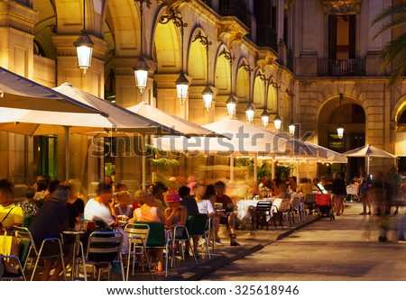 restaurants at Placa Reial in summer night. Barcelona, Catalonia