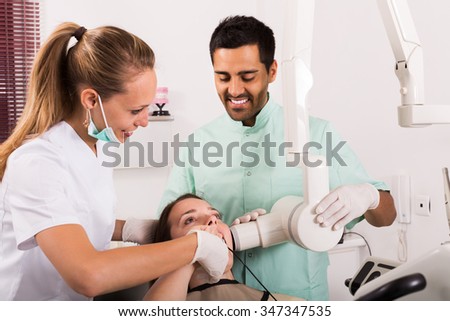 adult woman patient checking the teeth an digital xray