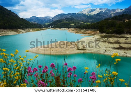 scenic landmark with Guadalest water storage with turquoise water located in valley
