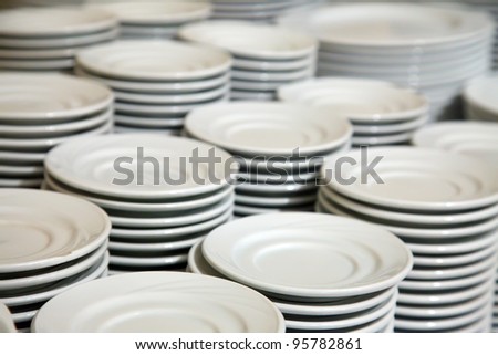 Many  white different plates stacked together