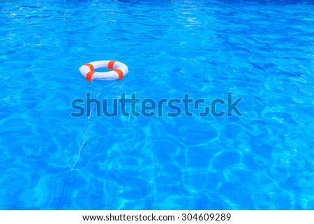 Life buoy floating in a swimming pool