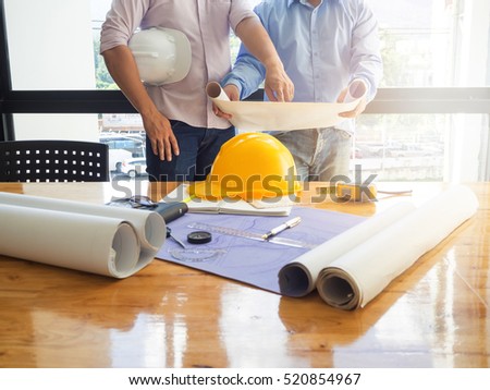 Architect concept, Architects working with blueprints in the office