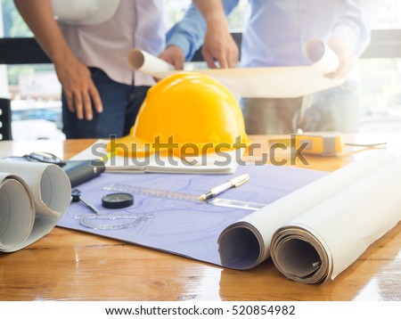 Architect concept, Architects working with blueprints in the office