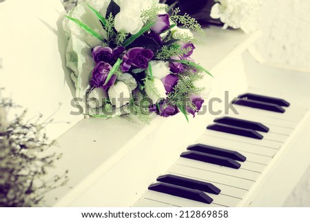 Wedding beautiful flowers on vintage piano