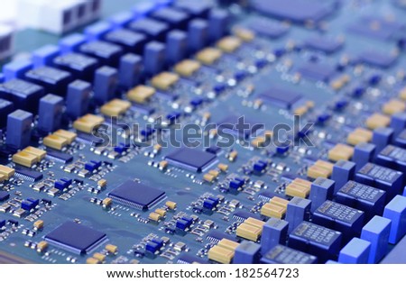 circuit board with electronic components in blue