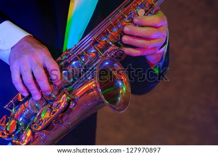 Saxophone musicians hands