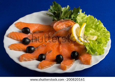 Plate of fish cuts isolated on blue