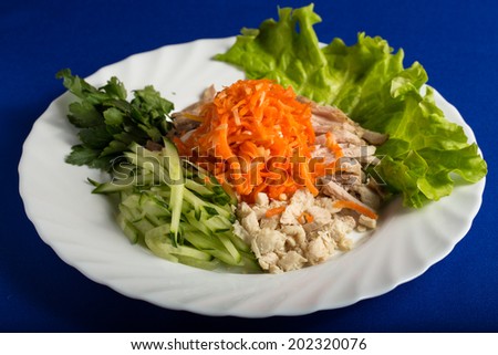 Salad of meat carrots cucumber