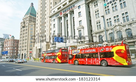 SHANGHAI, CHINA - JULY 21: Hop on Hop off sight seeing tour in Shanghai at the hangpu river on July 21, 2013 in Shanghai, The bund is the western bank of the Hangpu river facing pudong district.