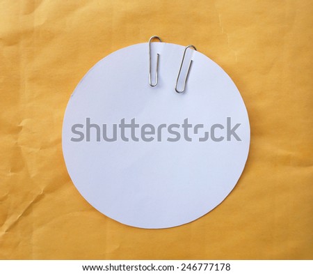 Circle white paper on brown paper background