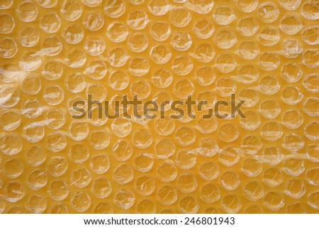 Yellow packaging with air bubbles background