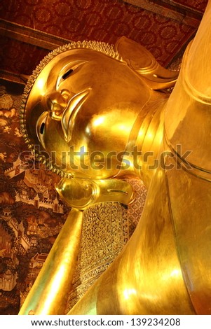 BANGKOK, THAILAND - OCTOBER 13 :The Reclining Buddha Image statue in Wat Pho on October 13,2012 in Bangkok, Thailand. This is one of the most famous Reclining Buddha Image.