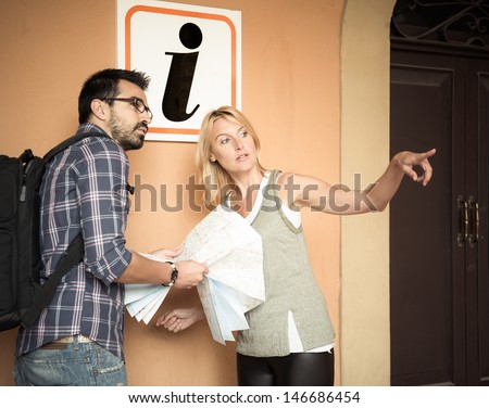 Tourist asks for information at info point