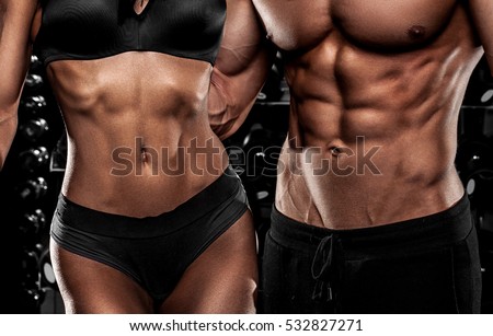beautiful couple in the fitness gym