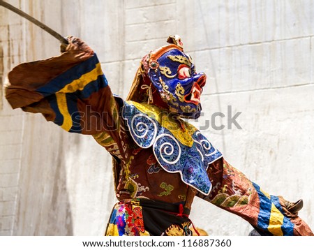 KORZOK, INDIA - JULY 23: An unidentified monk performs a religious mask dance during the Cham Dance Festival on July 23, 2012 in Korzok, India.