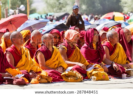 LEH, INDIA - AUGUST 7, 2012: The monks and lamas intently listening to the His Holiness the 14th Dalai Lama at the His Holiness teachings on August 7, 2012, Leh, Ladakh, Jammu and Kashmir, India